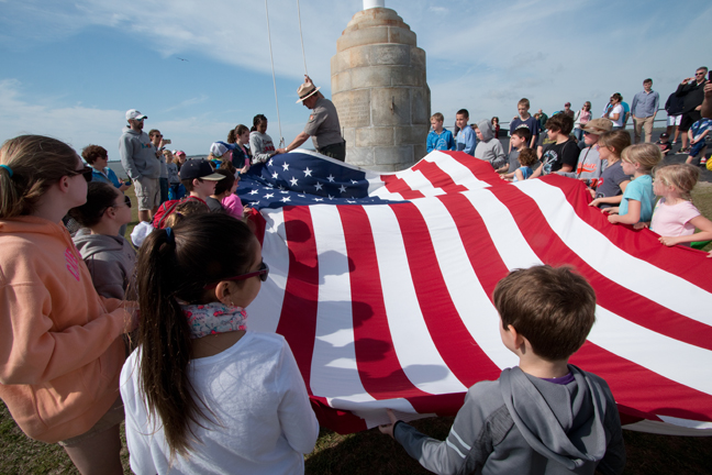 Children raising American Flag, Fort Sumter, South Carolina
