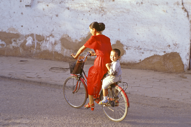 Mother and child on bicycle, Kashgar, China